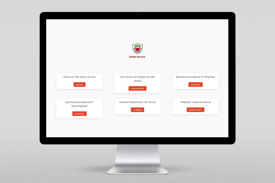 Desktop-Monitor zeigt eine Website mit Optionen für die Buchung von Kursen und Mitgliedsverwaltung.